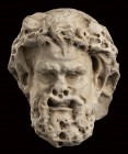 Roman Marble Relief of a Satyr, 2nd century AD; height cm 19 (cm 24,5 with Iron support); An impressive head of a bearded Satyr. This mithological cre...