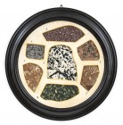 Lithothèque, 21th century; diam cm 45; Collection of ancient and rare marbles, polished in modern times and arranged in a black frame as precious furn...