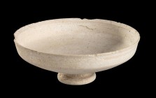 Islamic Unglazed Footed Bowl, probably from Nishapur, 10th - 12th century AD; height cm 6,5; diam cm 18,5. Intact. Provenance: English private collect...