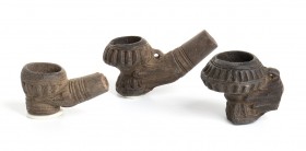 Group of Three Indochinese Terracotta Smoking Pipes, 19th century, length max cm 8. Provenance: English private collection.