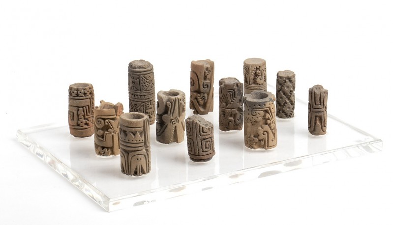 Collection of twelve terracotta cylindrical pintaderas, Colombia and Ecuador, Tu...