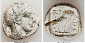 ATTICA. Athens. Ca. 455-440 BC. AR tetradrachm (25mm, 17.15 gm, 1h). VF, test cut. Early transitional issue. Head of Athena right, wearing crested Att...