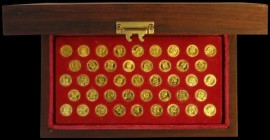 Kings and Queens of England a rare 43 miniature medal set in 22 carat gold, each piece depicting a monarch's portrait with shield in garter reverse an...