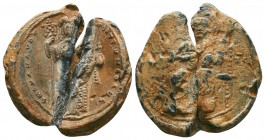 Imperial lead seal of the byzantine emperor Michael Doukas (1071-1078)
Obverse: Christ seated on a square-backed throne, wearing a tunic and himation...