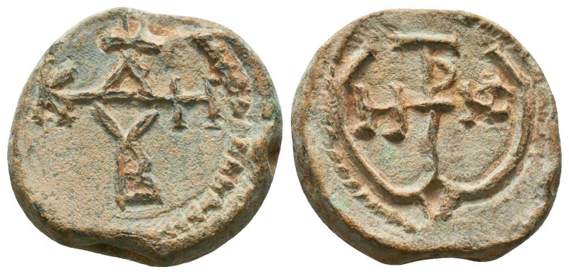 Byzantine lead seal of John stratelates (7th cent.)
Obv.: Invocative cruciform ...