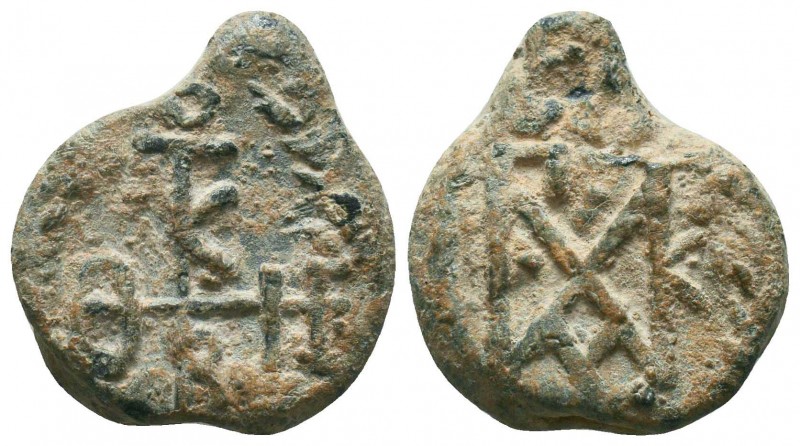 Byzantine lead seal of Paul spatharios and chartularios (AD 550-650)
Obv.: Invo...