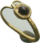 Ancient Roman Gold Earring with red stone inlaid, 1st - 2nd Century AD.

Condition: Very Fine

Weight: 1.2gr
Diameter: 12mm