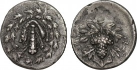 LYDIA. Tralleis. Cistophoric Drachm (Circa 166-67 BC).
Obv: Lion skin draped over club; all within ivy wreath.
Rev: TPAΛ.
Grape bunch on vine.
Cf. SNG...
