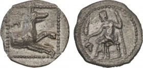 LYCAONIA. Laranda. Obol (Circa 324/3 BC).
Obv: Baal seated left on throne, holding grain ear, grape bunch and sceptre.
Rev: Forepart of wolf right; in...