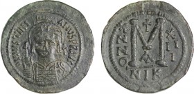 JUSTINIAN I (527-565). Follis. Nicomedia. Dated RY 13 (539/40).
Obv: D N IVSTINIANVS P P AVG.
Helmeted and cuirassed bust facing, holding globus cruci...