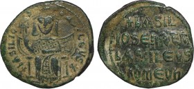 BASIL I THE MACEDONIAN (867-886). Follis. Constantinople.
Obv: + BASILIOS bASILEVS ✱.
Crowned figure of Basil enthroned facing, wearing loros, holding...