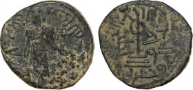 ARAB-BYZANTINE: Standing Caliph, ca. 692-697, AE fals. ND, A-3544, uncertain mint, appears to be something like bataqa, citing the caliph, Condition: ...