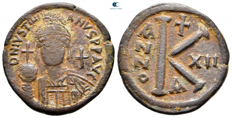 Justinian I AD 527-565. Constantinople
Half follis Æ

29 mm., 10,59 g.

ver...