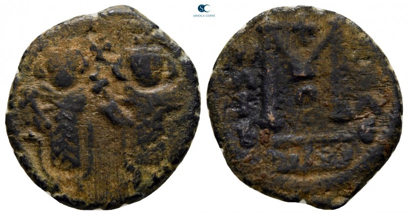 AD 680-693. Arab-Byzantine coinage. Dimashq (Damascus)
Fals Æ

19 mm., 3,45 g...