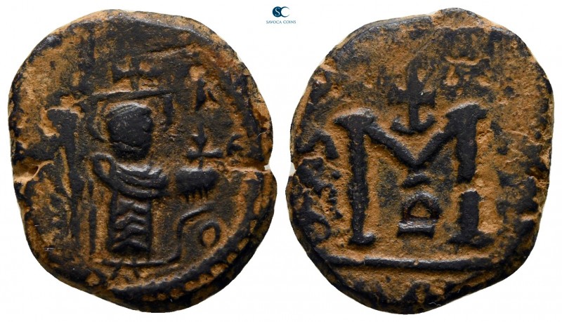 Time of 'Abd al-Malik ibn Marwan AD 685-705. AH 74-80. Hims
Fals Æ

18 mm., 3...