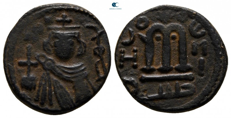 Time of 'Abd al-Malik ibn Marwan AD 685-705. AH 74-80. Hims
Fals Æ

17 mm., 3...