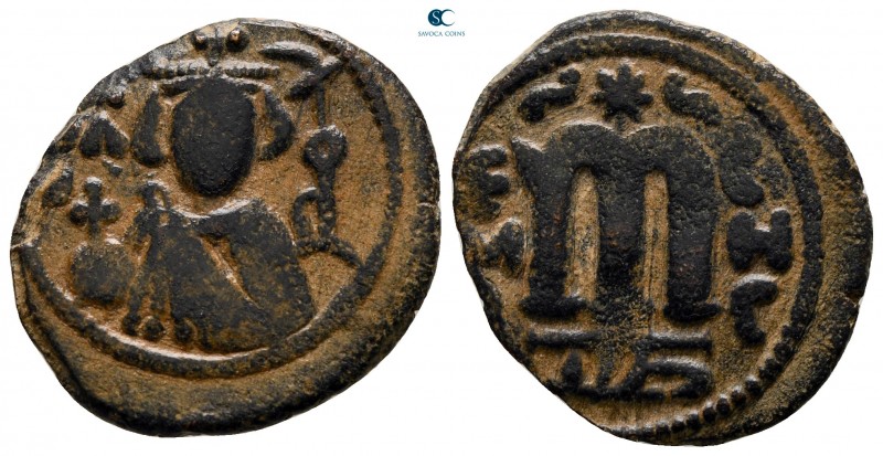 Time of 'Abd al-Malik ibn Marwan AD 685-705. AH 74-80. Hims
Fals Æ

22 mm., 4...