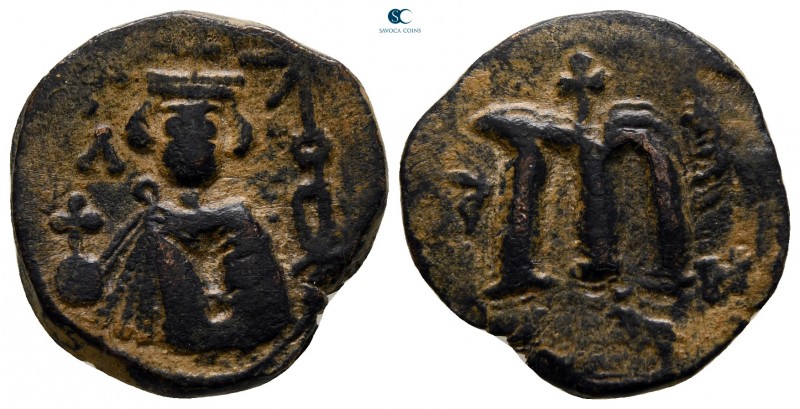 Time of 'Abd al-Malik ibn Marwan AD 685-705. AH 74-80. Hims
Fals Æ

18 mm., 3...