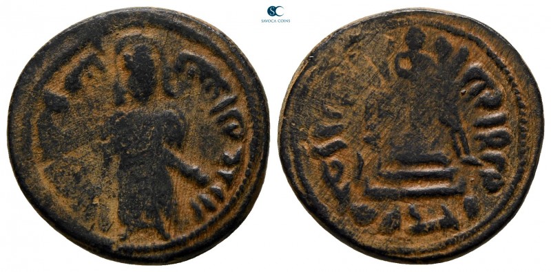 Time of 'Abd al-Malik ibn Marwan AD 685-705. AH 74-80. Hims
Fals Æ

18 mm., 3...