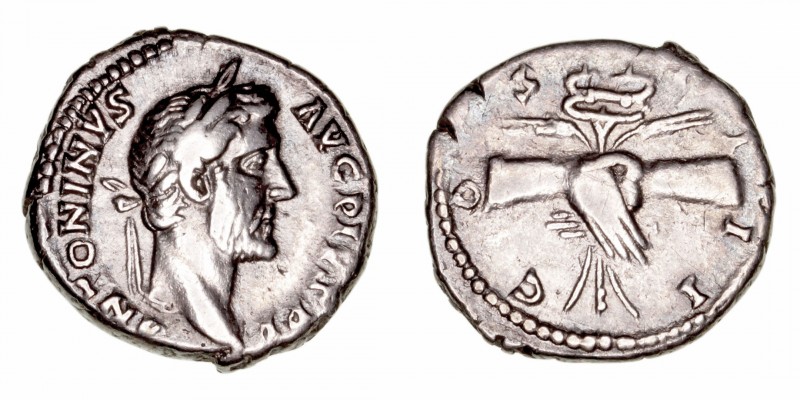 Antonino Pío
Denario. AR. Roma. (138-161). R/COS. III. Manos enlazadas y detrás...