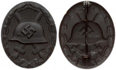 Germany Wound Badge in black(1939). Wound badge for the army 1939 in black; hollow embossed oval badge; central depiction of a steel helmet with a swa...