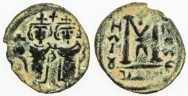 ARAB-BYZANTINE: Two Standing Figures, ca. 680s, AE fals (2.33g), Ba'albakk, ND, A-3513.2, city name in Arabic and with its Greek name Heliopolis repla...
