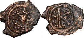 Uncertain emperor. AE Half follis, Constantinople mint, c. 5th-7th century. D/ Bust facing, crowned, holding globus cruciger. R/ Large K (mark of valu...