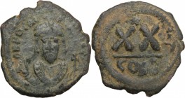 Phocas (602-610). AE Half Follis, Constantinople mint. D/ Bust facing, crowned, wearing consular robes, holding mappa and scepter topped by cross. R/ ...