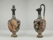 Apulian red-figure trefoil oinochoe." 3rd century AD." Height 26.5 cm." Repaired but in good conditions.