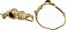 Gold ring with garnet inlaid. " Roman period, 1st-3rd century AD. " Size 17 mm. . AV. g. 0.90