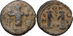 Umayyad Caliphate. Arab-Byzantine coinage (Pseudo-Byzantine type). AE Fals, Emesa mint, c. 660-680. D/ Caliph standing facing, holding scepter and glo...