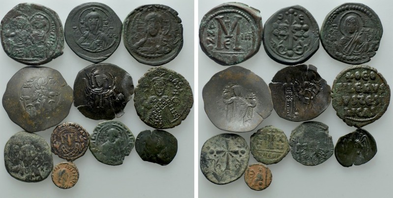 11 Byzantine Coins. 

Obv: .
Rev: .

. 

Condition: See picture.

Weigh...