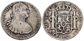 Carlos IV (1788-1808). 8 reales. 1803. Lima. JP. (Cal-767). Ag. 26,64 g. Resellos orientales. BC+. Est...40,00. /// ENGLISH: Charles IV (1788-1808). 8...