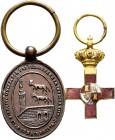 Lote de 2 condecoraciones en miniatura. Sitio de Bilbao 1874 (óvalo de 21 x 31 mm., con anilla de 31 mm.) y Mérito Militar color Rojo, sin escudete (1...