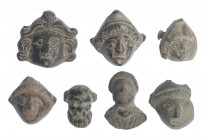 ROMA. Imperio Romano. II-IV d.C. Bronce. Lote de 7 objetos: 5 apliques con representación de Atis, un busto masculino y una máscara de esclavo. Altura...