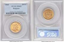 Leopold II gold 20 Francs 1868 MS65 PCGS, KM32. Die variety with beard closer to "S". A glowing representative whose surfaces exude velveteen charm an...