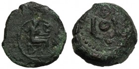 Islands of Sicily, Onkia, Lipara, c. 412-408 BC AE (g 1,21 mm 11 h 10) Hephaistos seated r., holding kantharos and hammer dotted border, Rv. ΛI, one p...