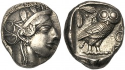 Attica, Tetradrachm, Athens, After 449 BC AR (g 16,75 mm 22 h 12) Head of Athena r., wearing crested Attic helmet, decorated with a olive wreath and p...