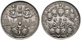 Augsburg
Silberne Ratsmedaille (Schautaler) 1697 von P.H. Müller. Stadtansicht von Osten, darüber St. Ulrich und St. Afra mit dem Stadtpyr in Wolken,...