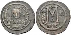 Justinian I, 527-565. Follis (Bronze, 44 mm, 22.76 g, 6 h), Nicomedia, RY 12 = 538/9. D N IVSTINI-ANVS P P AVC Diademed, helmeted and cuirassed bust o...