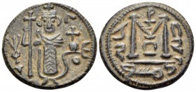 ISLAMIC, Umayyad Caliphate. Uncertain period (pre-reform), AH 41-77 / AD 661-697. Fals (Bronze, 18 mm, 3.70 g, 7 h), Arab-Byzantine type, imitating Co...
