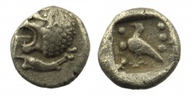 Caria, Mylasa. Ca. 420-390 B.C. AR Trihemitetartemorion
Obv: Head of a roaring lion left 
Rev: Bird standing left with pellets flanking, all within in...