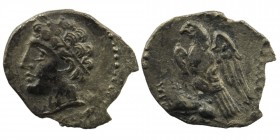 CILICIA, Uncertain. 4th century BC. AR Obol 
Obv: Male head left, wearing wreath of grain ears.
Rev: Eagle standing left, spreading wings, on back of ...