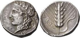 Metapontum. Nomos circa 400-380, AR 7.61 g. Head of Dionysus l., wearing diadem with leaves; beneath neck trun­cation, ΣΠ. Rev. META[Π] Barley-ear wit...