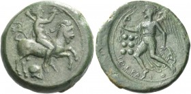 Himera. Hemilitra circa 420-410, Æ 6.29 g. Nude rider on goat r., holding whip and conch; below, Corinthian helmet. Rev. Nike flying l., holding open ...