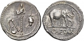 Iulius Caesar. Denarius, mint moving with Caesar 49-48, AR 3.90 g. Pontifical emblems: culullus, aspergillum, axe and apex. Rev. Elephant r., tramplin...
