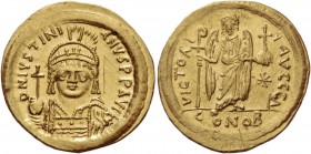 Justinian I, 527 – 565. Solidus 545-565, AV 4.51 g. D N IVSTINI – ANVS P P AVG Helmeted, pearl-diademed and cuirassed bust three-quarters facing, hold...