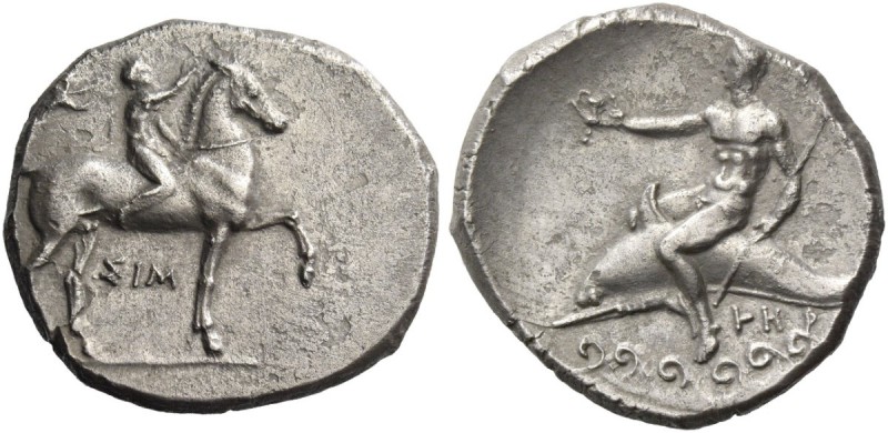 Calabria, Tarentum. Nomos circa 333-330 BC, AR 7.47 g. Naked ephebus seated on h...