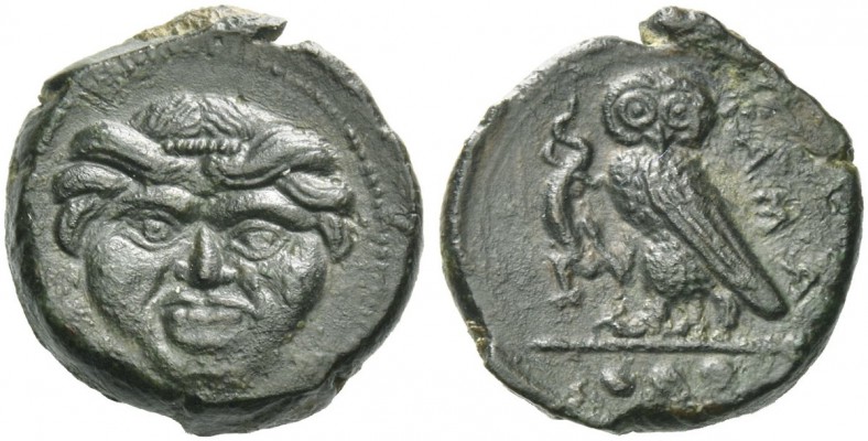 Camarina. Tetras circa 420-410, Æ 3.34 g. Gorgoneion, hair bound with fillet. Re...