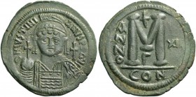Justinian I, 527 – 565. Follis year XII (538-539), Æ 22.13 g. Helmeted, pearl-diademed and cuirassed bust facing, holding globus cruciger and ornament...